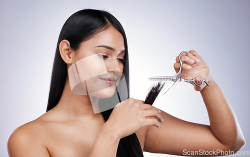 Image of Hair care, woman with scissors cutting ends on long hairstyle, damage treatment and white background in Brazil. Beauty, healthy haircut and latino model, salon cut on studio backdrop and mockup space