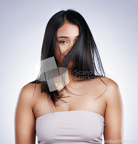 Image of Hair in face, beauty and portrait of woman with long hair, smile and luxury salon treatment on white background in Brazil. Style, makeup and latino model with straight hairstyle on studio backdrop.