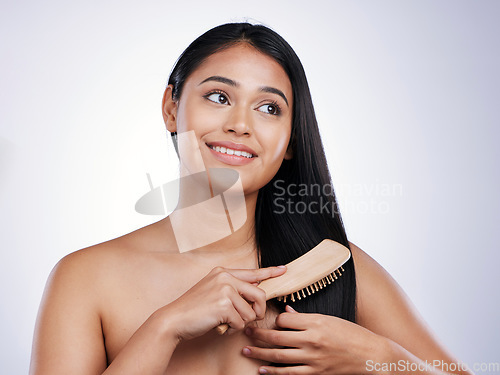 Image of Hair care, smile and face of woman with brush, styling and luxury salon treatment on white background in Brazil. Style, haircut and happy latino model brushing straight hairstyle on studio backdrop.