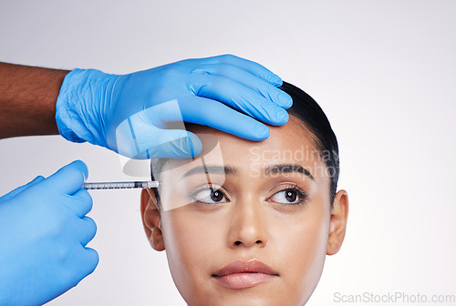 Image of Woman, studio and injection with hands, surgery or worry with thinking, doubt or collagen by white background. Girl cosmetic surgeon and filler with idea, pain or fear for beauty, skincare or change