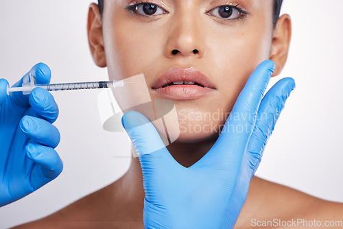 Image of Woman, needle and studio portrait for lips, surgery or cosmetics for skin, collagen or face by white background. Girl, cosmetic surgeon and filler for mouth, syringe or hands for beauty with skincare