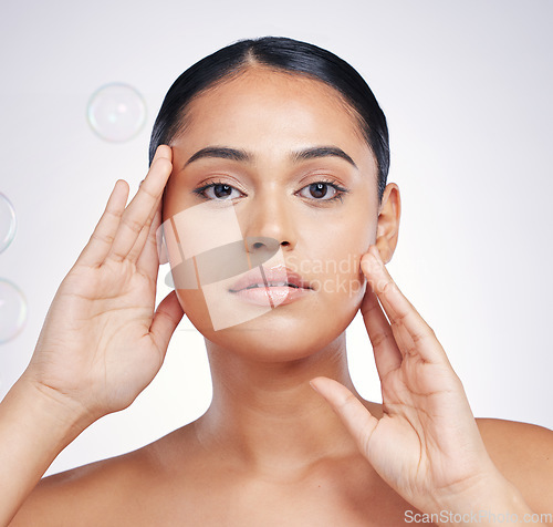 Image of Beauty, natural and woman with hands on face in studio for glow, skin dermatology or cosmetic. Portrait of aesthetic model person with bubbles for self care, facial or skincare on a white background