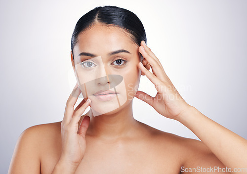 Image of Beauty, skin and woman with hands on face in studio for glow, dermatology or natural cosmetics. Portrait of aesthetic model person with self care, facial or skincare results on a white background