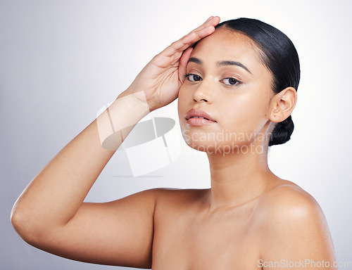 Image of Beauty, face and portrait of a woman in studio for skin glow, dermatology or natural cosmetics. Headshot of aesthetic model person with self care, facial or skincare results on a white background