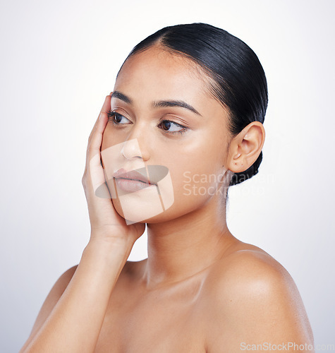 Image of Beauty, natural and face of a woman in studio for skin glow, dermatology or cosmetics. Headshot of aesthetic model person thinking of self care, facial or skincare benefits on a white background