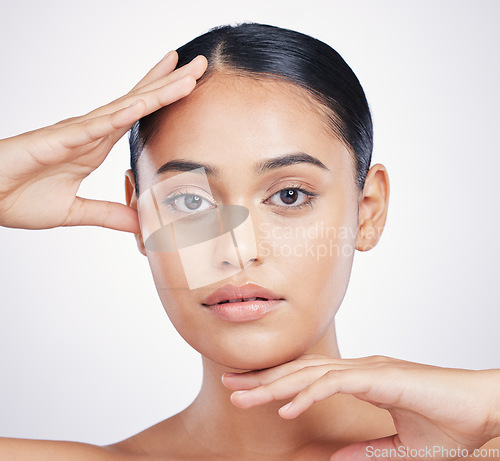 Image of Natural, beauty and woman with hands on face in studio for skin dermatology and cosmetics. Portrait of aesthetic model person from Portugal for facial self care or skincare glow on a white background