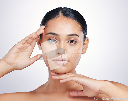 Image of Beauty, natural and woman with hands on face in studio for skin glow, dermatology or cosmetics. Portrait of aesthetic model person from Portugal for facial self care or skincare on a white background