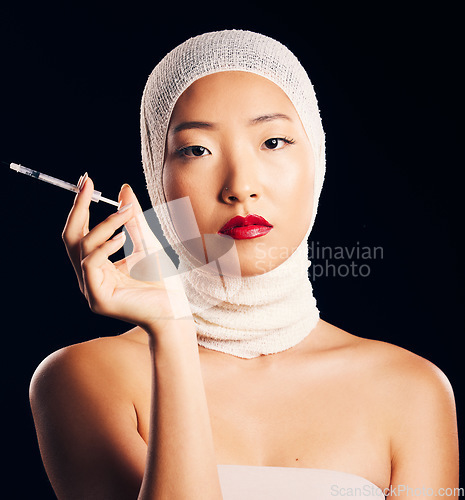 Image of Woman, portrait and plastic surgery with syringe, bandage and studio background with asian beauty for filler. Female person, face and cosmetology with injection for skin, collagen and treatment.