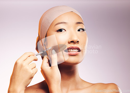 Image of Woman, bandage and plastic surgery with injection on face in studio background for asian beauty. Model, skincare filler and collagen with cosmetic treatment, syringe and cheek for facial facelift.