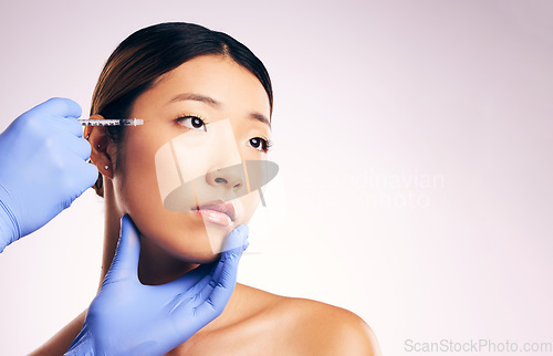 Image of Face injection, skincare and Asian woman with plastic surgery in studio isolated on white background mockup space. Cosmetics, syringe and model with dermal filler for dermatology, facelift or beauty