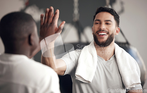 Image of Fitness, people with high five and at gym for exercise or training happy for support. Teamwork or collaboration, partnership or workout and men athletes with handshake for motivation or success