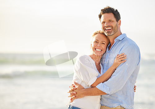 Image of Happy couple hug on beach, love and travel with anniversary vacation, tourism and mockup space. Happiness, trust and commitment with man and woman on tropical holiday, ocean and affection outdoor