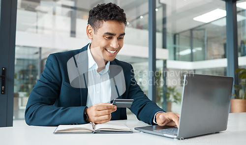 Image of Credit card, business man and laptop with online banking, payment and ecommerce store. Office, male professional and smile of a corporate worker with web shopping on an internet retail shop at work