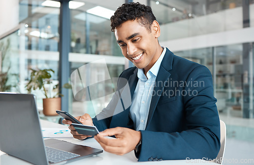 Image of Credit card, business man phone and laptop with online banking, payment and ecommerce store. Office, male professional and smile of a corporate worker with web shopping on an internet shop at work