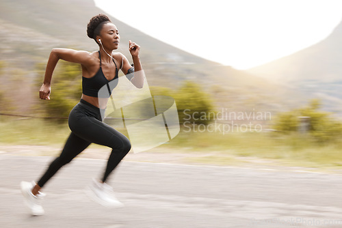 Image of Athlete, speed and fast black woman running and training for outdoor sports, workout and exercise for a marathon. Strong, wellness and healthy fitness person or female runner with speed for health