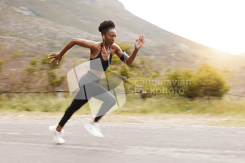 Image of Athlete, fitness and fast black woman running and training for outdoor sports, workout and exercise for a marathon. Strong, wellness and healthy female person or runner with speed for health