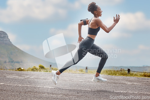 Image of Athlete, wellness and fast woman running and training for outdoor sports, workout and exercise for a marathon. Strong, fitness and healthy female person or runner with speed, sprint and health