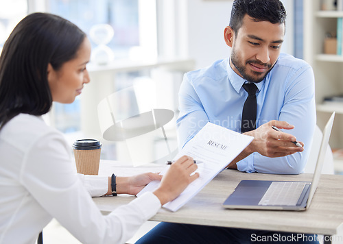 Image of Meeting, CV and business people with laptop for interview, job vacancy or opportunity in office. Corporate, recruitment and man and woman in conversation for hiring with document, resume and computer