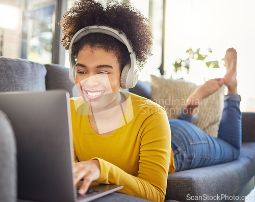 Image of Laptop, headphones and woman relax on sofa for e learning, online education and audio translation or website service. Happy student or african person on couch, audio technology and computer for home