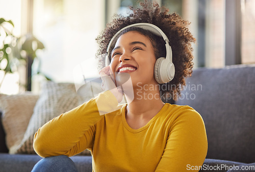 Image of Headphones, music and happy woman in home mental health, wellness ideas and youth radio or streaming service. Relax, listening and thinking or inspiration of young african person on audio technology