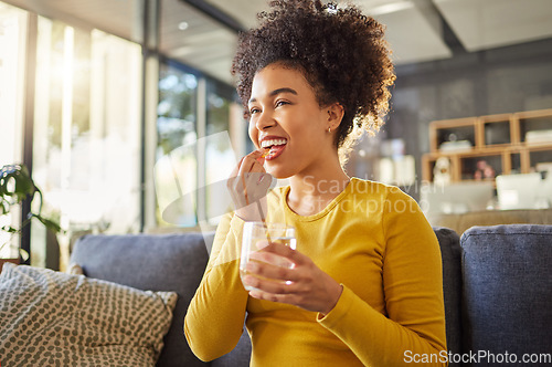 Image of Glass, water and woman with medicine on sofa for health, self care and supplement at home. Relax, healthcare and happy african person with liquid drink and pill or tablet for wellness on couch