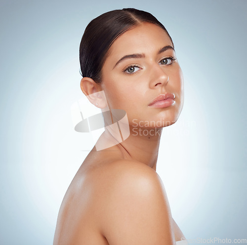 Image of Serious face, skincare and woman in studio isolated on a white background. Portrait, natural beauty or female model in makeup, cosmetics or spa facial treatment for skin health, aesthetic or wellness
