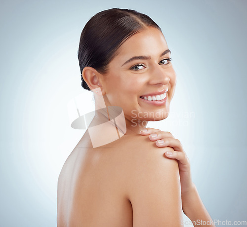 Image of Face, beauty skincare and smile of woman in studio isolated on a white background. Portrait, natural and female model in makeup, cosmetics or facial treatment for skin health, aesthetic or wellness.