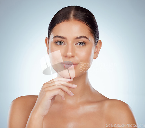 Image of Face, beauty skincare and confident woman in studio isolated on a white background. Portrait, natural and female model in makeup, cosmetics or facial treatment for skin health, aesthetic or wellness.
