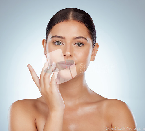 Image of Face, serious skincare and beauty of woman in studio isolated on a white background. Portrait, natural and female model in makeup, cosmetics or facial treatment for skin health, aesthetic or wellness