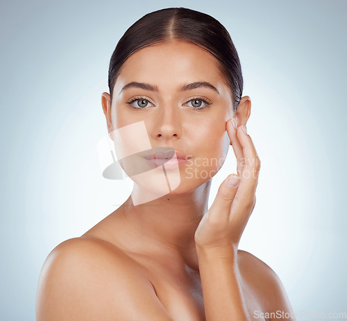 Image of Smooth face, skincare and woman in studio isolated on a white background. Natural beauty, portrait and serious female model in makeup, cosmetics or facial treatment for health, aesthetic or wellness.