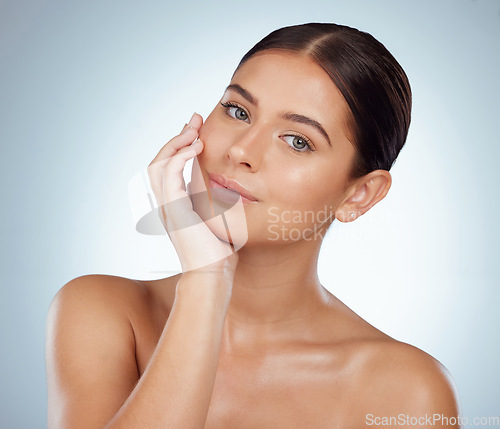 Image of Face, skincare and beauty of confident woman in studio isolated on white background. Portrait, natural and female model in makeup, cosmetics or facial treatment for skin health, aesthetic or wellness