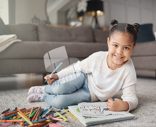 Image of Portrait of happy kid, girl and pencils for coloring on living room floor for education, learning and creative development. Cute child, books and crayons for writing, drawing and creativity of art