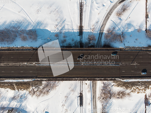 Image of Aerial view of a road in winter landscape