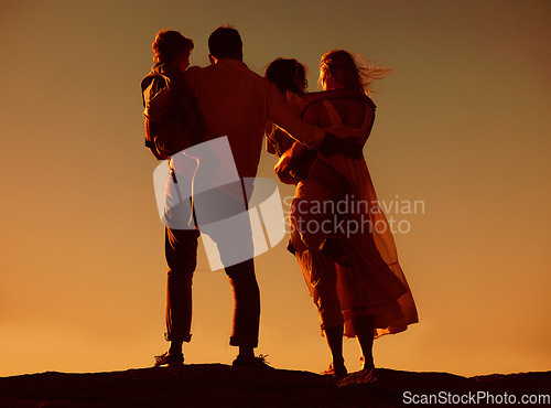 Image of Parents, children and silhouette on mountain, sunset and hug with love, care and summer adventure. Mother, father and young kids with sky background, bond and outdoor on holiday, vacation or journey