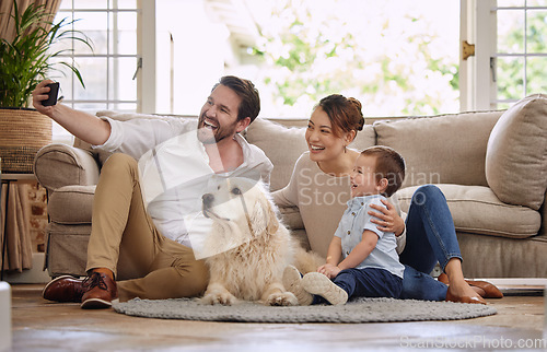 Image of Selfie, social media and happy family in the living room with a dog for internet. Smile, playing and parents, baby and a pet taking a photo for the web, chat or profile picture on the house floor