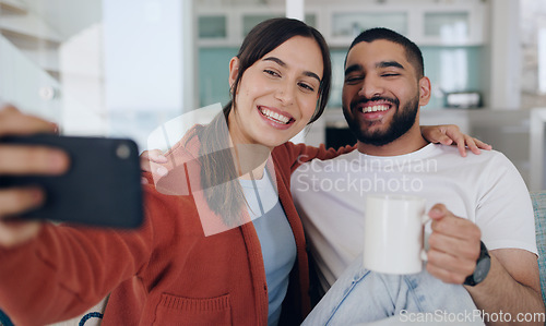 Image of Home, selfie and couple smile on sofa for social media post, online vlog and internet with coffee. Dating, morning and happy man and woman take picture for update, bonding and relax in living room
