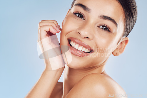 Image of Portrait, skincare and woman with dermatology, natural beauty and luxury against a blue studio background. Face, female person and model with spa treatment, cosmetics and makeup with shine and glow