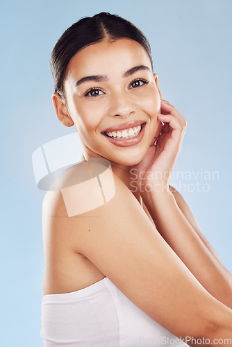 Image of Portrait, skincare and woman with cosmetics, dermatology and grooming against blue studio background. Face, female person and girl with natural beauty, luxury and spa treatment with luxury and makeup