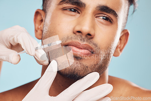 Image of Beauty, botox and mouth with a man in studio on a gray background for a plastic surgery injection. Hands, skincare and syringe with a young male patient indoor for an antiaging facial filler closeup