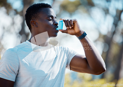 Image of Man, outdoor and asthma inhaler to breathe with allergies, asma or lungs problem while running. Black male runner with emergency medicine pump for health and breathing in a spring forest in nature