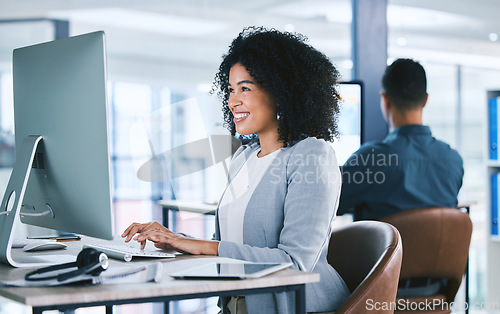 Image of Woman, typing at computer with online tech support and email, consultant at desk with smile at customer service agency. Contact center, communication and happy female agent with feedback and help