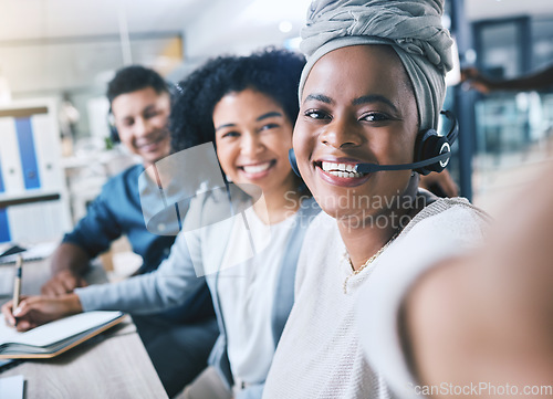 Image of Diversity, portrait of colleagues with headset and taking a selfie together at their workplace desk with a lens flare. Telemarketing or call center, customer service and coworkers happy for support