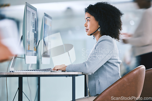 Image of Call center, customer service and woman at computer with a headset on contact us website. African person as crm, telemarketing and sales or technical support agent with headphones, focus and desktop