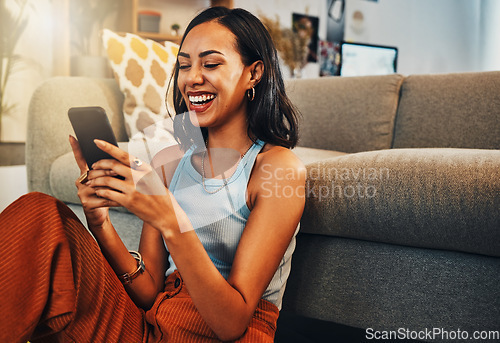 Image of Woman laughing at chat on smartphone, social media and funny meme with communication and technology. Female person relax at home, using phone and comedy online with streaming and texting on app