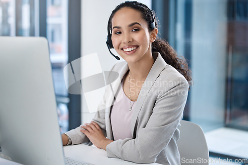 Image of Call center, consultant woman and pc with smile in office for customer service, tech support and IT advice with voip. Crm, telemarketing or agent in portrait with microphone, consulting and help desk