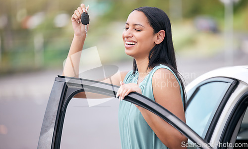 Image of Excited, happy woman driver with new car, key and smile on face with loan, auto insurance and luxury transport. Happiness, freedom to drive and proud customer with keys for motor vehicle in street.