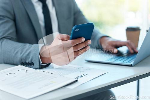 Image of Hands of man with laptop, phone and desk at startup checking email, social media and search on internet at business. Online report, networking and businessman in office typing or reading on cellphone