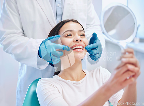 Image of Dental consultation, mirror and woman with smile after teeth whitening, service or mouth care. Healthcare, dentistry and happy female patient with orthodontist for oral hygiene, wellness and cleaning