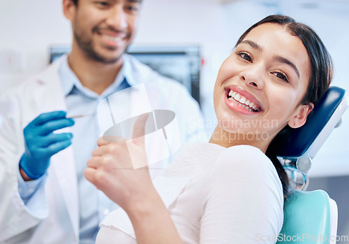 Image of Happy, thumbs up and portrait of dentist and patient for teeth whitening, service and dental care. Healthcare, dentistry and hand sign of orthodontist and woman for oral hygiene, wellness or cleaning