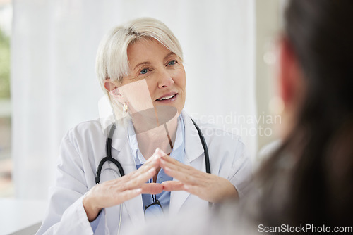 Image of Patient, doctor and woman in consultation, discussion and diagnosis with treatment, cure and explain health issue. Mature female employee, medical professional and client talking, results and advice